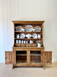 An Early 19th Century Pine Irish Dresser or Cupboard with Wooden Knobs