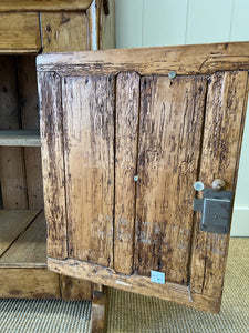 An Early 19th Century Pine Irish Dresser or Cupboard with Wooden Knobs