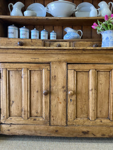 An Early 19th Century Pine Irish Dresser or Cupboard with Wooden Knobs
