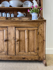 An Early 19th Century Pine Irish Dresser or Cupboard with Wooden Knobs