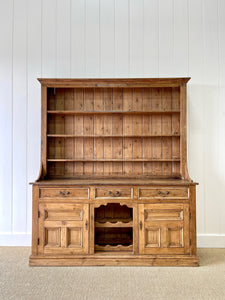 An Early 19th century Rustic Pine Welsh Dresser or Cupboard with Brass Hardware
