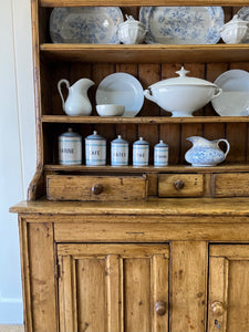 An Early 19th Century Pine Irish Dresser or Cupboard with Wooden Knobs