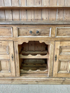 An Early 19th century Rustic Pine Welsh Dresser or Cupboard with Brass Hardware