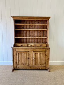 An Early 19th Century Pine Irish Dresser or Cupboard with Wooden Knobs