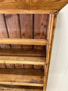 An Early 19th Century Pine Irish Dresser or Cupboard with Wooden Knobs