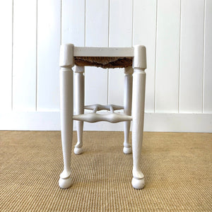 A Painted Stool with Rush Seat and Spoon Feet
