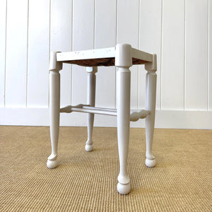 A Painted Stool with Rush Seat and Spoon Feet