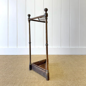A 19th Century English Brass Umbrella or Stick Stand with Iron Underplate c1890