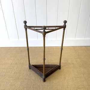 A 19th Century English Brass Umbrella or Stick Stand with Iron Underplate c1890
