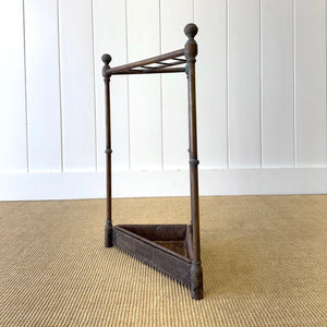 A 19th Century English Brass Umbrella or Stick Stand with Iron Underplate c1890