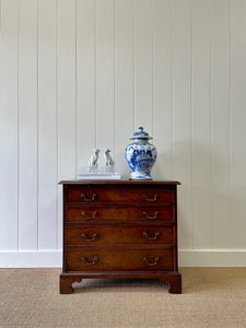 A Petite English Mahogany Bachelors Chest of Drawers Dresser with Brushing Slide  c1800