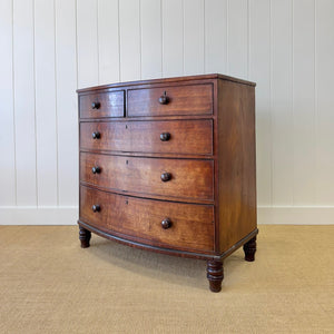 A Large Antique English Bow Front Mahogany Chest of Drawers