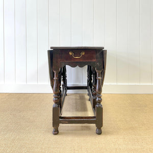 A Very Good Antique English Country Oak Drop Leaf Gate Leg Table with Drawer