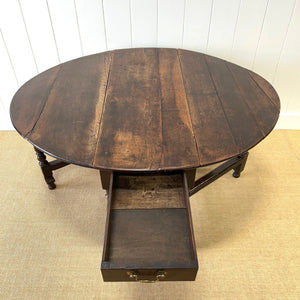 A Very Good Antique English Country Oak Drop Leaf Gate Leg Table with Drawer