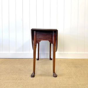 An Antique 18th Century Drop Leaf Dining Table with Pad Feet