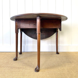 An Antique 18th Century Drop Leaf Dining Table with Pad Feet