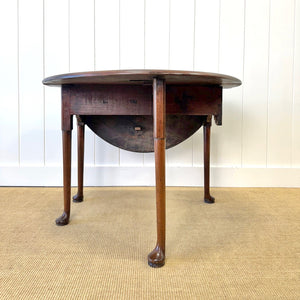 An Antique 18th Century Drop Leaf Dining Table with Pad Feet