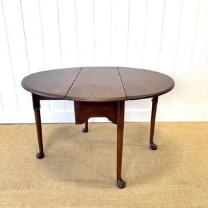 An Antique 18th Century Drop Leaf Dining Table with Pad Feet