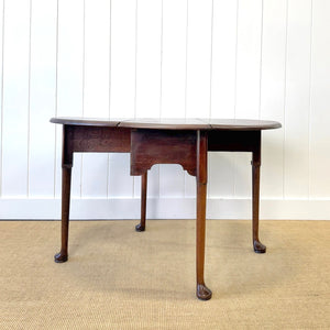 An Antique 18th Century Drop Leaf Dining Table with Pad Feet