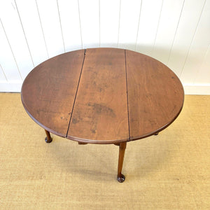 An Antique 18th Century Drop Leaf Dining Table with Pad Feet