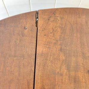 An Antique 18th Century Drop Leaf Dining Table with Pad Feet