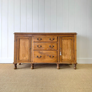 An English Country 7 Drawer Pine Buffet or Sideboard