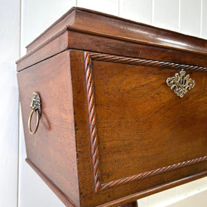 A Georgian Mahogany Cellarette Table with Rising Lid