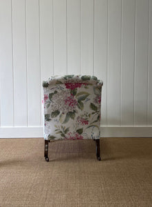 An Antique English Oak Floral Lounge Chair