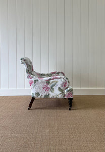 An Antique English Oak Floral Lounge Chair