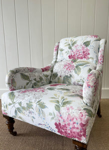 An Antique English Oak Floral Lounge Chair