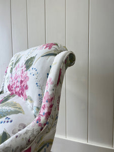 An Antique English Oak Floral Lounge Chair