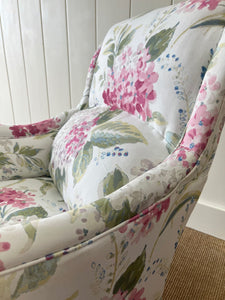 An Antique English Oak Floral Lounge Chair