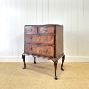 A Queen Anne style figured walnut chest on stand c1750