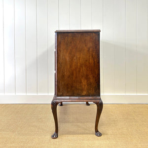 A Queen Anne style figured walnut chest on stand c1750