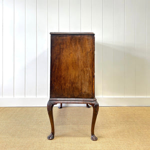 A Queen Anne style figured walnut chest on stand c1750
