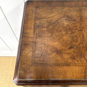A Queen Anne style figured walnut chest on stand c1750