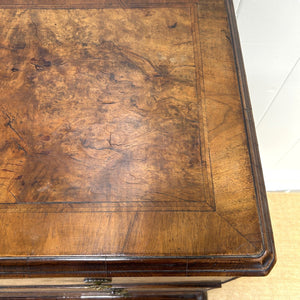 A Queen Anne style figured walnut chest on stand c1750