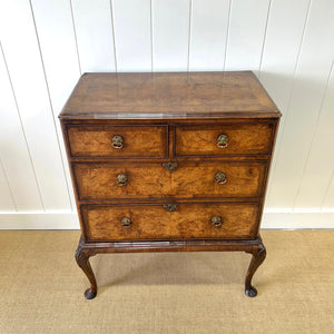 A Queen Anne style figured walnut chest on stand c1750