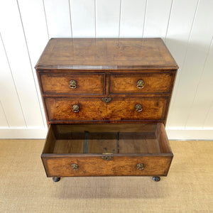 A Queen Anne style figured walnut chest on stand c1750