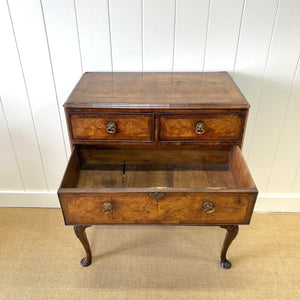 A Queen Anne style figured walnut chest on stand c1750