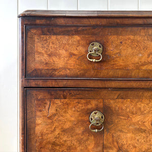 A Queen Anne style figured walnut chest on stand c1750