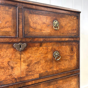 A Queen Anne style figured walnut chest on stand c1750