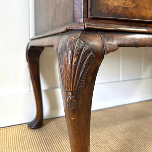 A Queen Anne style figured walnut chest on stand c1750