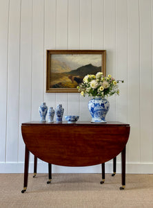 A Large English Georgian Country Mahogany Drop Leaf Table on Castors c1800