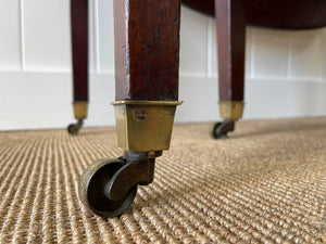 A Large English Georgian Country Mahogany Drop Leaf Table on Castors c1800