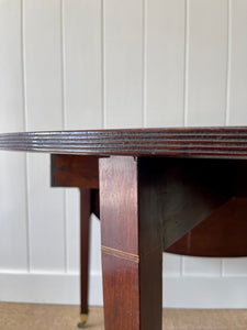 A Large English Georgian Country Mahogany Drop Leaf Table on Castors c1800