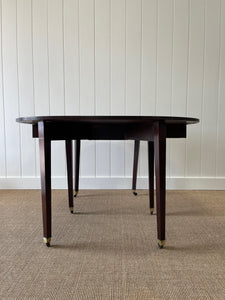 A Large English Georgian Country Mahogany Drop Leaf Table on Castors c1800