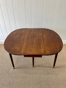 A Large English Georgian Country Mahogany Drop Leaf Table on Castors c1800
