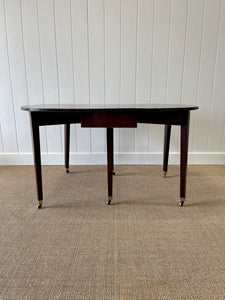 A Large English Georgian Country Mahogany Drop Leaf Table on Castors c1800