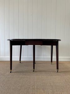 A Large English Georgian Country Mahogany Drop Leaf Table on Castors c1800